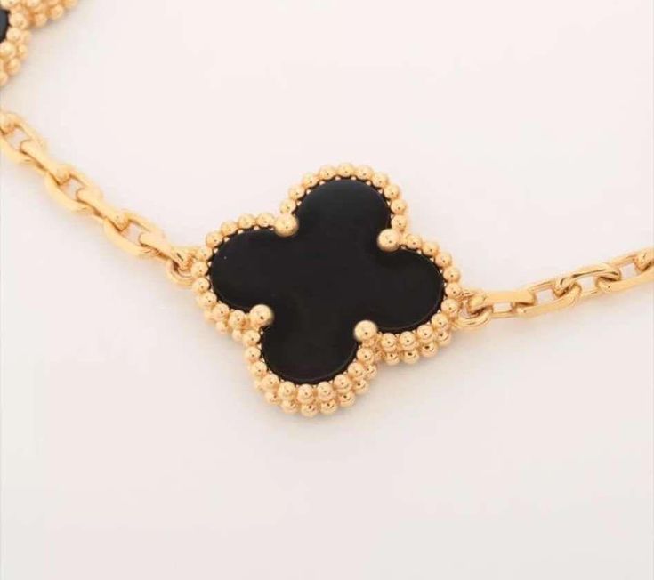 CLOVER 5 MOTIFS BLACK ONYX 18KT GOLD